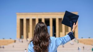 Woman with Diploma on Square
